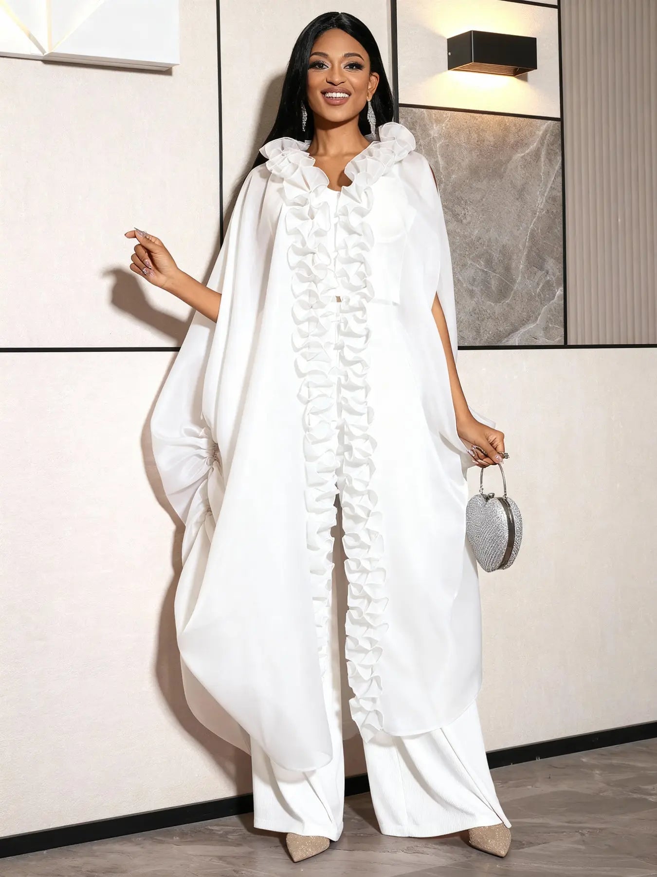 VVZ Ruffled sleeveless loose top paired with high-waisted wide-leg pleated trousers